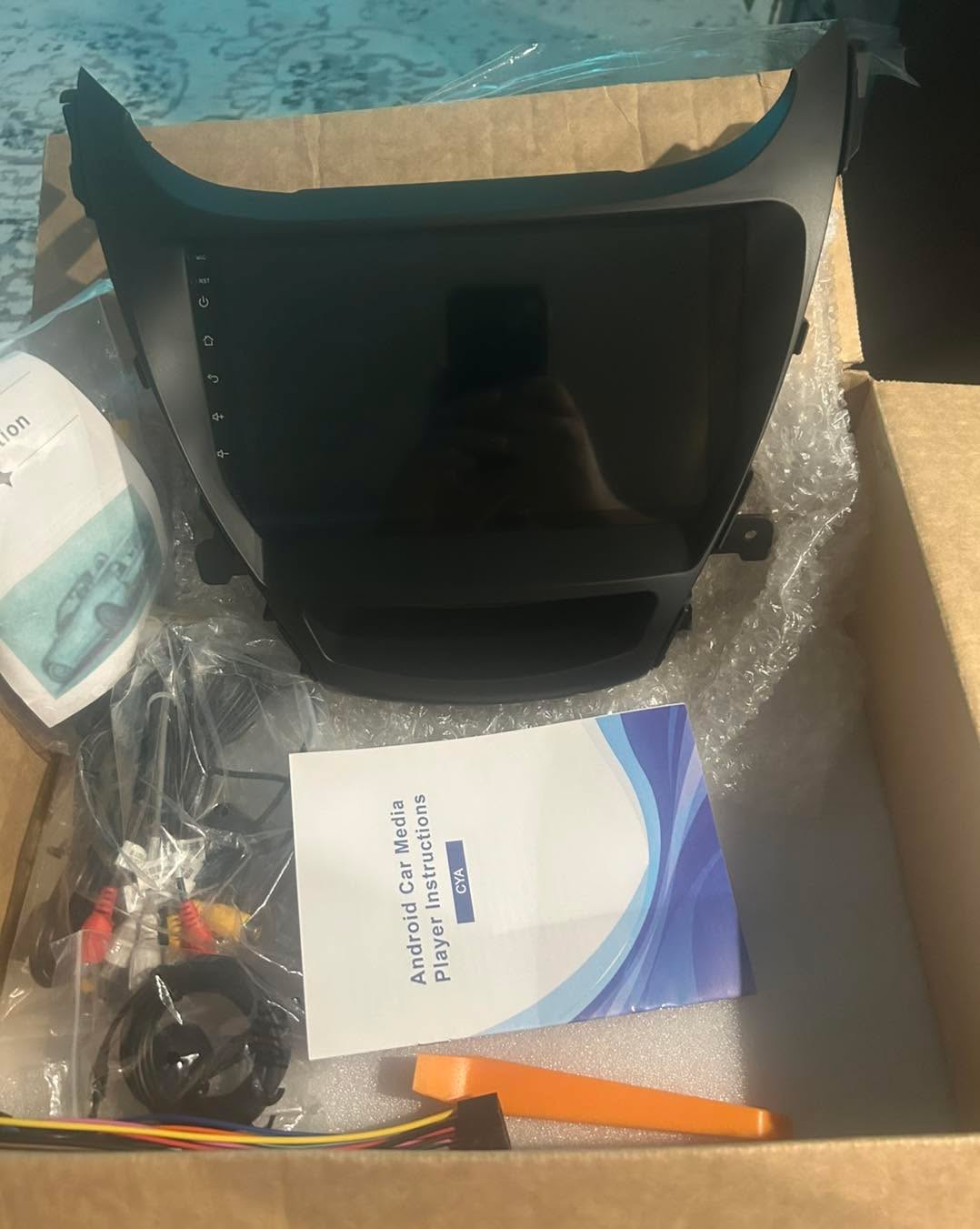 New Apple CarPlay head unit kit ready to install with tools and Audioman sticker